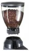 A coffee grinder hopper filled with coffee beans, positioned above the base of the grinder. Podgląd zdjęcia produktu