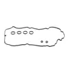 A black valve cover gasket with several circular grommets laid out on a white background. Produktbild-Vorschau