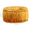 A round, mustard yellow pouf with decorative pom-poms around the top edge, shown against a white background. Dimensions are indicated by measurement lines. Podgląd zdjęcia produktu
