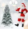 A Christmas tree and a Santa Claus figure are shown in a festive, snowy scene with bokeh lights. Produktbild-Vorschau