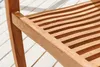 A close-up view of a wooden chair seat and frame, resting on a white wooden deck. Produktbild-Vorschau