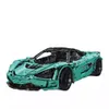 A teal-colored toy sports car, resembling a building block set, is shown from a three-quarter front angle against a white background. Produktbild-Vorschau