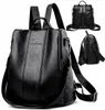 A black leather backpack is displayed from multiple angles against a white background. Náhľad obrázku produktu