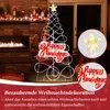 A decorated Christmas tree with lights and a "Happy Holidays" sign, placed indoors near a fireplace, with inset images of the star and the sign. Podgląd zdjęcia produktu