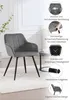 A grey armchair with black legs is shown in a room with a white rug and a small round table. The image also includes several inset images highlighting product features. Produktbild-Vorschau