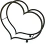A black metal heart-shaped firewood rack with two small black spheres at the bottom for support, set against a white background. Produktbild-Vorschau