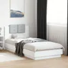 A white bed frame with a gray tufted headboard in a bedroom setting. Anteprima dell’immagine prodotto