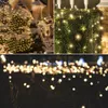 Collage of images showing Christmas lights used for decoration on trees, hedges, and fences. Produktbild-Vorschau