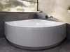 A modern bathroom with a corner bathtub, grey tiled walls, and a window with greenery visible outside. Produktbild-Vorschau