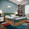 A bedroom scene featuring a bed, nightstands, a bookshelf, and a desk with a chair. Produktbild-Vorschau