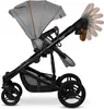 A close-up side view of a gray baby stroller against a white background. Anteprima dell’immagine prodotto