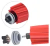 A close-up view of disassembled vacuum cleaner brush parts, with a magnified inset showing a connected component. Produktbild-Vorschau