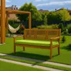 A wooden garden bench with a green cushion sits on a lush green lawn, with a hammock and pergola in the background. Anteprima dell’immagine prodotto