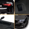A collage of close-up images showing different parts of a black electric BMW M4 Competition toy car. Anteprima dell’immagine prodotto