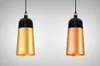 Two pendant lights, one with a gold finish and the other with a copper finish, are displayed against a light gray background. Produktbild-Vorschau