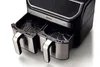 A close-up shot of the front of a black and silver dual-basket air fryer, with the two baskets pulled out. Podgląd zdjęcia produktu