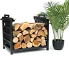A black metal firewood rack filled with logs, placed next to a potted green plant. Náhľad obrázku produktu