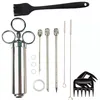 A collection of barbecue tools laid out on a white background. Produktbild-Vorschau