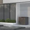 A modern outdoor setting with a trash can enclosure next to a building with large windows. Anteprima dell’immagine prodotto