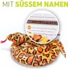 A plush snake toy is coiled in the center of the image, with a magnified circular inset showing a product tag. Produktbild-Vorschau