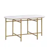 A white marble-top oval dining table with gold metal legs, shown from a slightly elevated side angle against a white background. Voir les images du produit