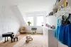 A child's room with toys and decorative wall panels. Produktbild-Vorschau