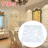 A dining room with a decorative screen divider and a framed picture on the wall. Náhled obrázku produktu