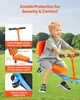A young boy is happily riding a colorful outdoor swing set in a grassy area. Náhled obrázku produktu