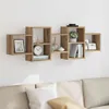A wooden wall shelf unit mounted on a white wall above a sofa. Náhľad obrázku produktu