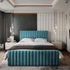 A bedroom with a large blue upholstered bed as the main focus. Produktbild-Vorschau