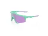 A pair of sports sunglasses with purple lenses and green and light purple frames, presented on a white background. Náhled obrázku produktu