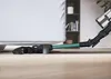 A vacuum cleaner head is shown cleaning under a bed. Produktbild-Vorschau