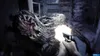 A first-person perspective of a player shooting a grotesque monster in a dark, confined space. Produktbild-Vorschau