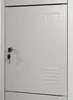 A close-up view of a gray metal locker door with a key in the lock and a ventilation grate. Náhľad obrázku produktu