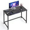 A gaming desk setup with a monitor, keyboard, mouse, and headphones. Produktbild-Vorschau