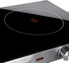 A close-up view of a black induction cooktop with a red hand symbol indicating it is hot. Anteprima dell’immagine prodotto