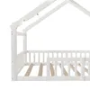 A close-up side view of a white wooden house-shaped bed frame with string lights. Produktbild-Vorschau