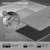 A close-up view of someone installing vinyl flooring, with text overlays highlighting features and benefits. Podgląd zdjęcia produktu