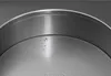 A close-up view of the inside of a round baking pan, showing water droplets. Produktbild-Vorschau