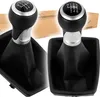 A collage of two car gear shift knobs with black leather boots, with a cardboard box in the background. Náhľad obrázku produktu