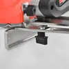 A close-up view of a power tool's base and adjustment mechanism. Produktbild-Vorschau