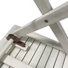Close-up view of the underside of a white wooden table, showing a metal bracket and a wooden dowel. Produktbild-Vorschau