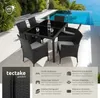 A rattan garden furniture set with a table and chairs by a swimming pool. Náhled obrázku produktu