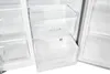 The interior of an open refrigerator with clear drawers. Podgląd zdjęcia produktu