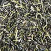 A close-up, overhead view of horse feed, showing a mixture of pellets, seeds, and straw. Anteprima dell’immagine prodotto
