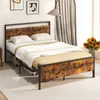 A bed frame with a mattress and bedding in a room. Produktbild-Vorschau