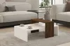 A modern living room scene with a couch and coffee table. Produktbild-Vorschau