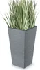 A tall, square planter with a textured gray finish and green grass-like plants inside, set against a white background. Voir les images du produit