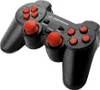 A black gamepad with red buttons and joysticks on a white background. Voir les images du produit