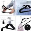 Collage showing velvet hangers in different scenarios: a hand holding a hanger, hangers on a rod, a bundle of hangers, and a hanger with a scarf. Anteprima dell’immagine prodotto